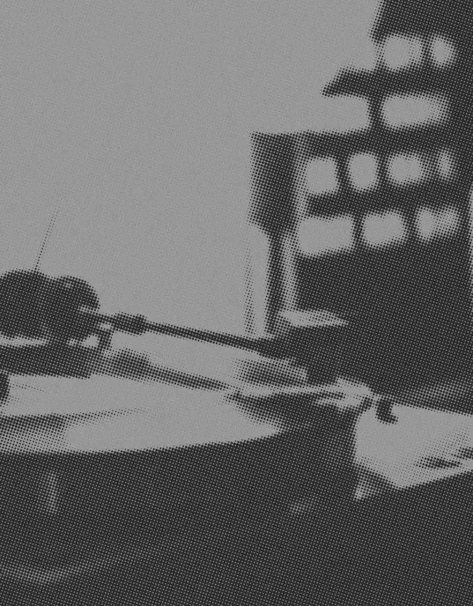Grainy black-and-white photo of a record player